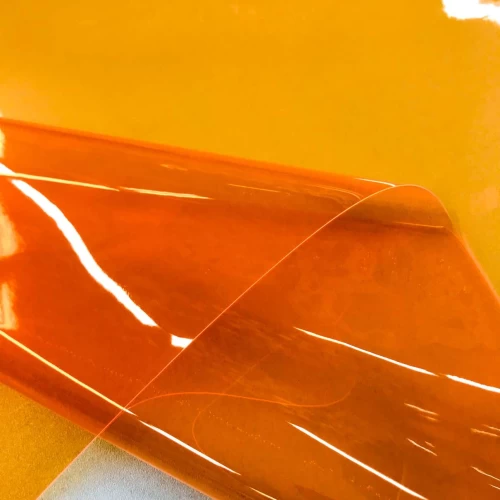 Plástico Cristal Colorido 0.40 - 100% PVC - Larg. 1,40M - Laranja neon Plástico Cristal Colorido 0.40 - 100% PVC - Larg. 1,40M - Laranja neon